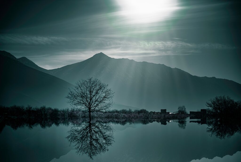 sicananda yoga body of water with mountains nearby